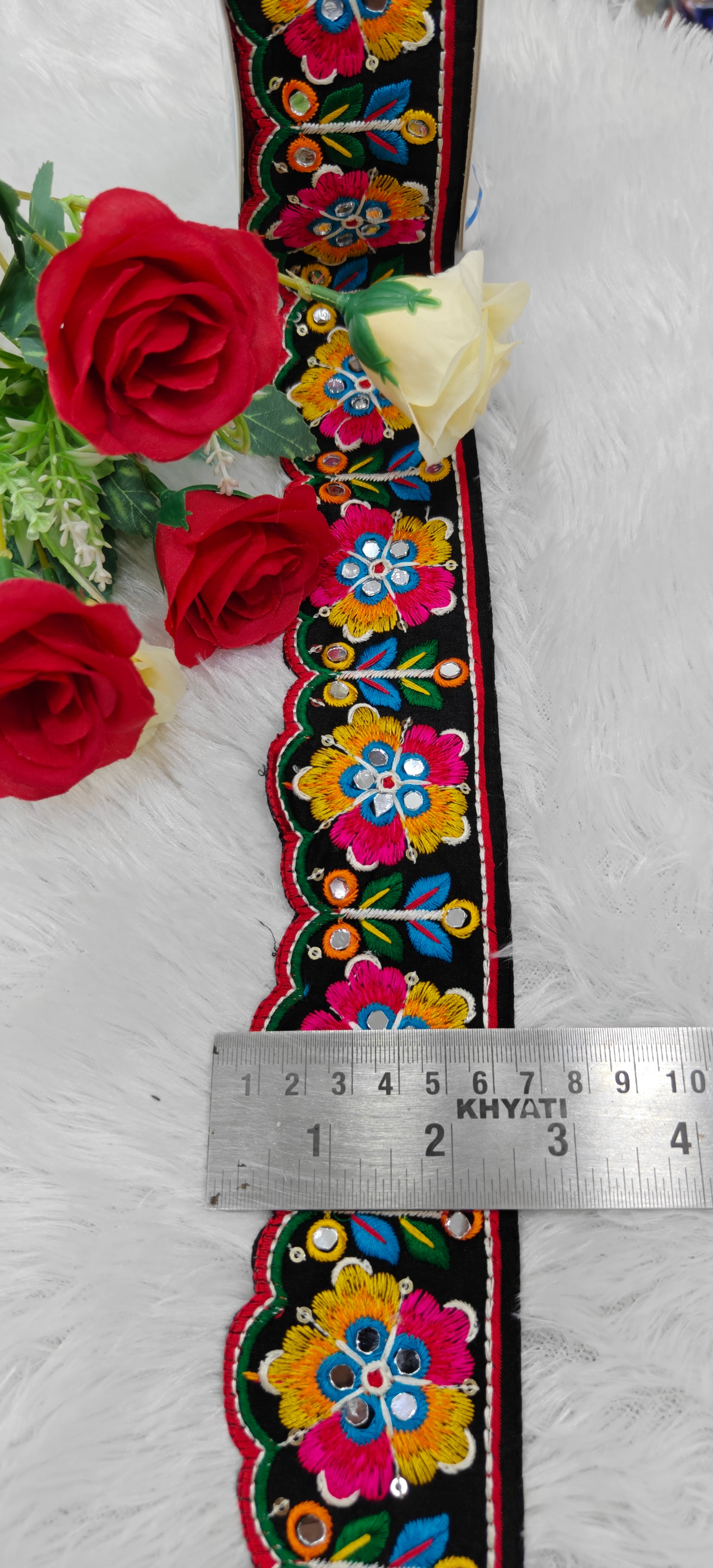 Traditional floral embroidery design with scalloped edges